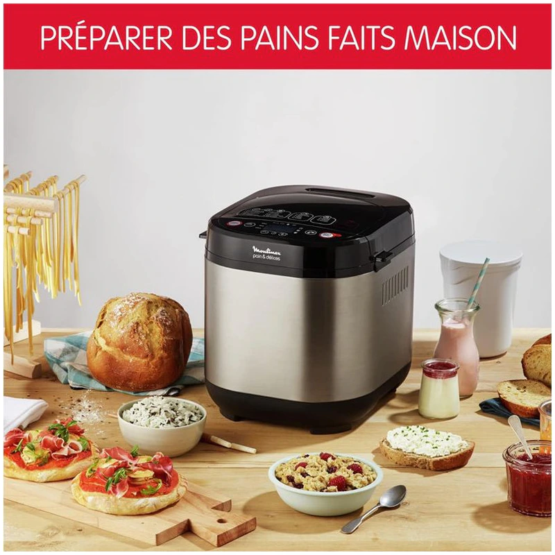 Machine Moulinex OW240E30 entourée de pains et préparations faits maison